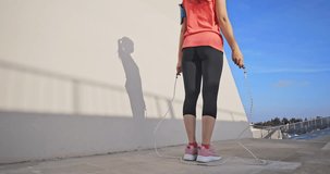 closeup slow motion of woman sport and rope skipping outdoor