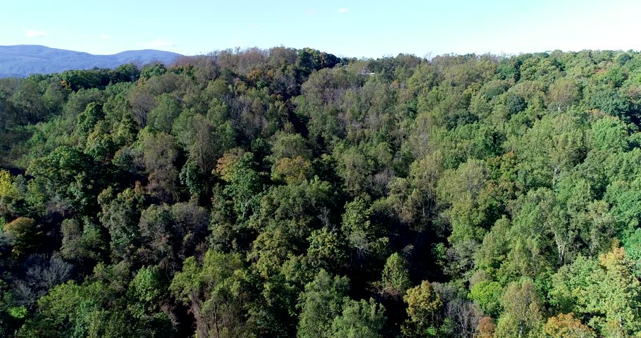Ascending shot of the Virginia countryside and the shenandoah range in the appalachian mountains towards West Virginia.