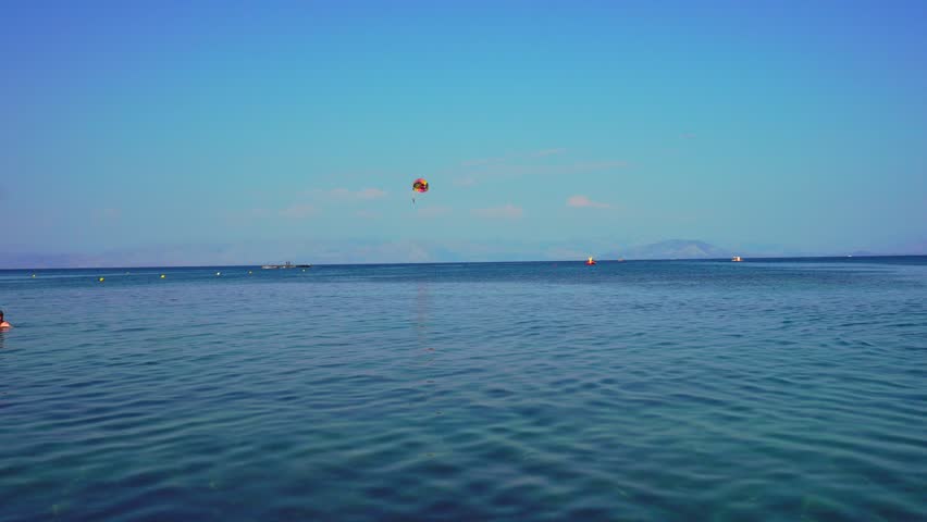 Parasailing over ionian sea in Corfu, Greece