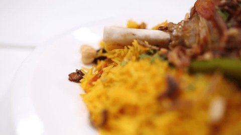 cooked rise with meat with spices  in Saudi traditional way kabsa with laham