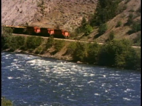 BRITISH COLUMBIA, CANADA, 1990, Frasier River, two freight trains on both sides