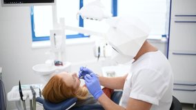 Doctor dentist in polygonal panda mask make oral hygiene dental treatment surgery in dental cabinet. Funny video