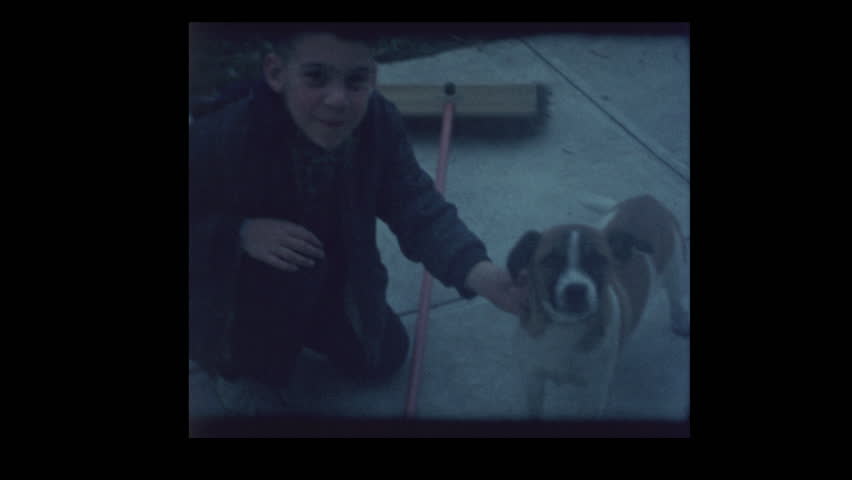 1964 Cute 5 year old boy and dog tricks