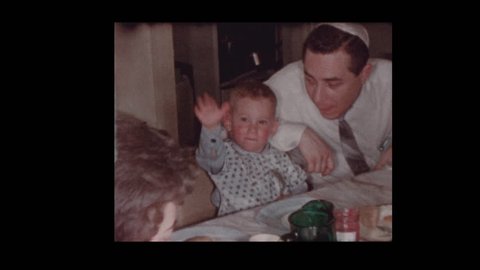 1956 Jewish family eating at Passover seder