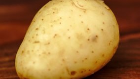Macro video of preparing potato with chip slicer