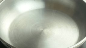 Video shot of pouring vegetable oil for frying