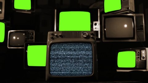 Stacked Retro Televisions turning On and Off Green Screen. Sepia Tone. Zoom In. You can replace green screen with the footage or picture you want. You can do it with “Keying” effect in After Effects.