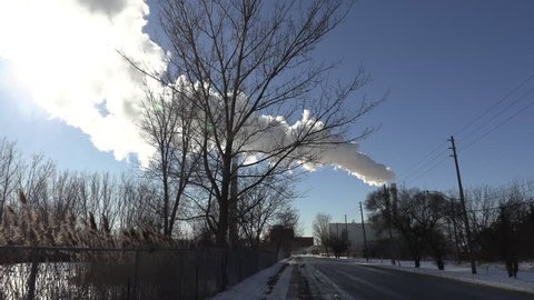 Toronto, Ontario, Canada January 2019 Gas powered electricity generator smokestacks billowing into the atmosphere