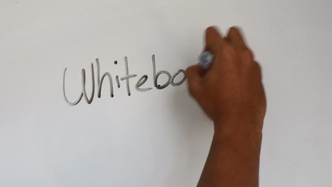 Hand writing on white board using marker.