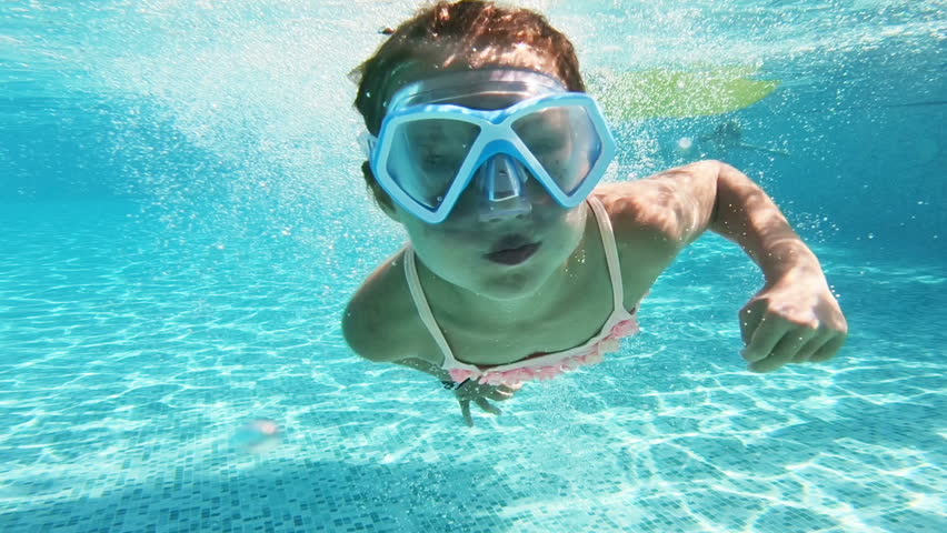 Little girl wearing snorkeling mask swimming underwater in the pool. Slow motion | Shutterstock HD Video #1022974480