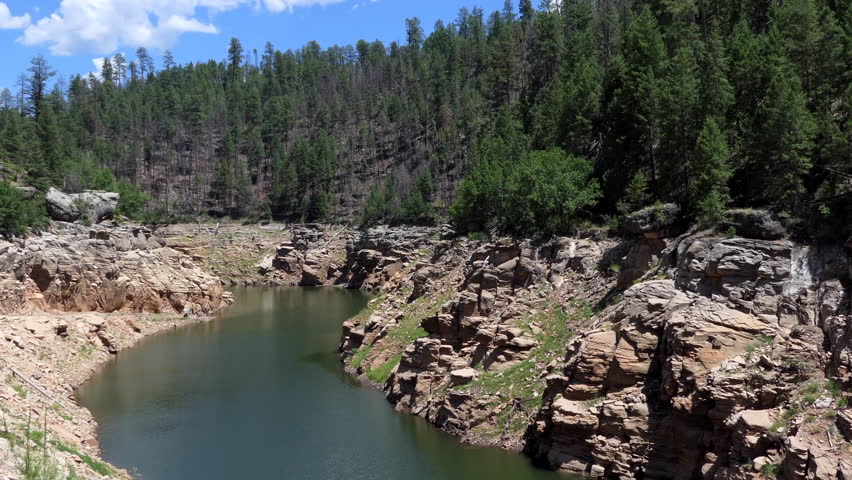 View of the Blue Ridge Reservoir in the Mogollon Rim area (Coconino National Forest) of the state of Arizona, United States of America. American natural landscape with lake, water, trees, forest in US