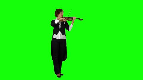 Girl in the jacket plays the violin. Green screen