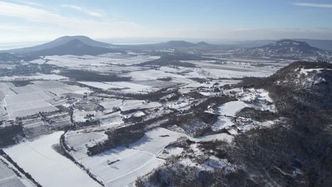 Hungary - aerial video of the wine region in the Kali basin in winter, covered in snow