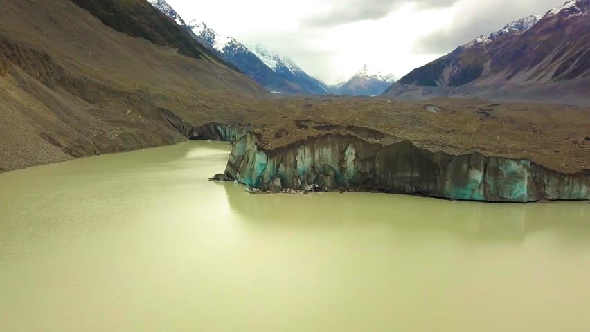 Aerial view of a Tasman glacier, Tasman lake and mountains around in South Island of New Zealand