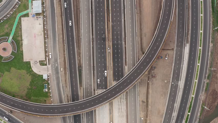 new construction highway freeway motorway bypass and ring road connecting the city for transportation and logistics business in Thailand aerial top view from drone footage 