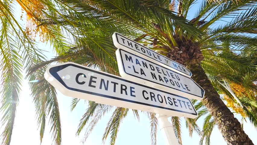 Street signs with direction and names on Boulevard in Cannes France Royalty-Free Stock Footage #1022996584