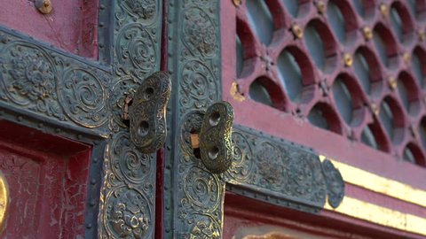 Closeup shot of the ancient doors in an inner part of the Forbidden city - ancient palace of China's emperor