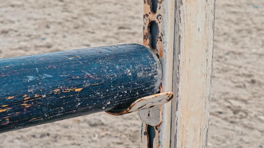 The rider changes the height of the obstacles for jumping. Slow motion. Training horses before the competition. 
