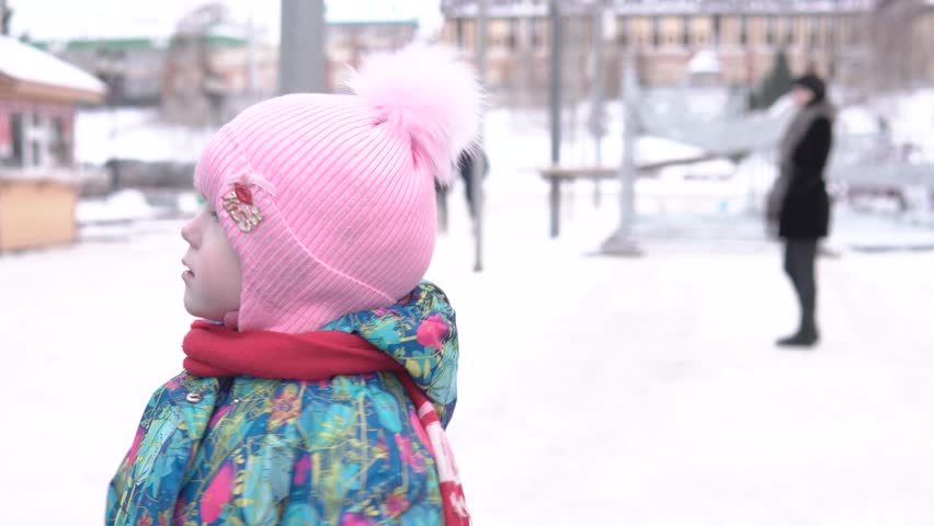 Girl walking on winter street