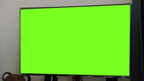 Modern Television with Chroma Key Green Screen. Zoom In. You can replace green screen with the footage or picture you want. You can do it with “Keying” effect (check out tutorials on YouTube). 