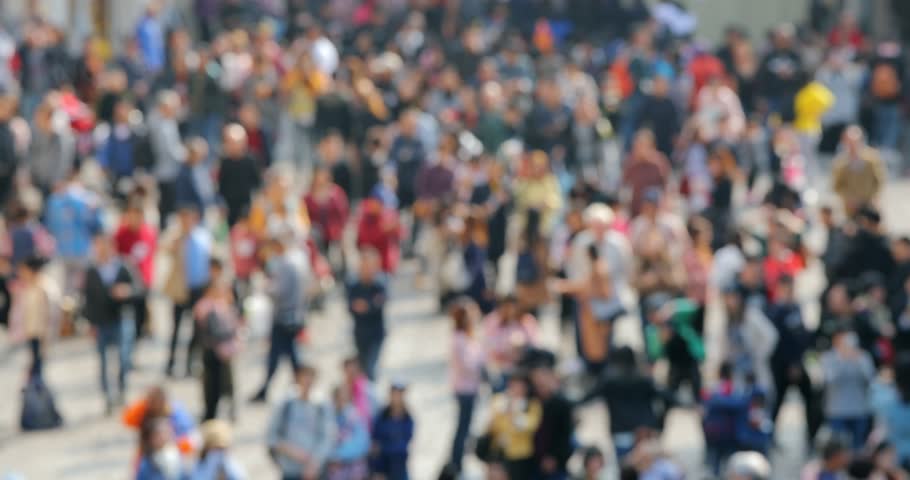 Blur of people walk in the street