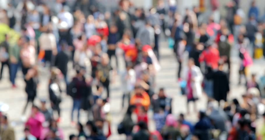 Bokeh of people walk in the street