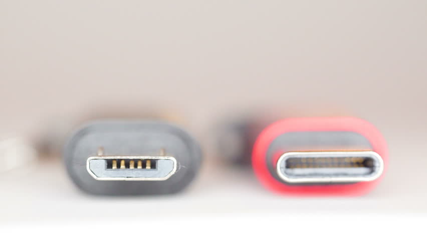 Two tips of the USB- micro and USB-C on a macro shot on top of the white table Royalty-Free Stock Footage #1023032500