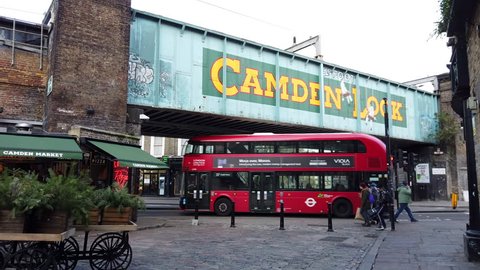 CAMDEN, LONDON - JANUARY 9, 2019: Visitors walking past the iconic Camden Lock railway bridge in Camden, North London, UK.