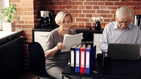 Mature, worried couple counting bills with laptop in the kitchen
 - Powered by Shutterstock - Get 15% off with code: PIKWIZARD15