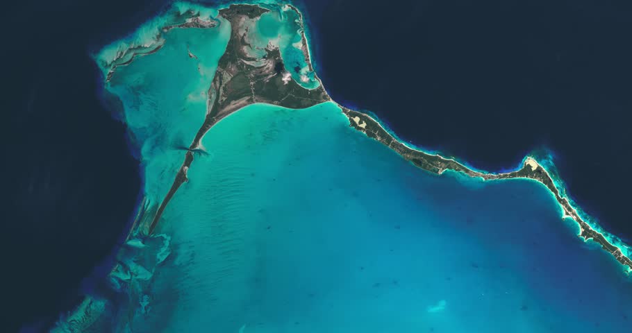 Bahamas aerial seen from satellite high altitude at space. Reef, coastline shallow and deep blue sea both sides of the islands. Contains modified Copernicus Sentinel data (2018).
