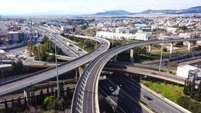 Aerial drone bird's eye view video of latest technology cross shape multi level road highway passing through city center