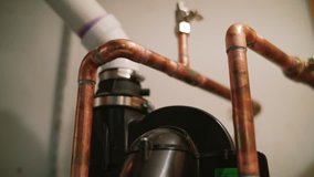 House hold water pipe and plumbing close up dolly shot of house - Powered by Shutterstock - Get 15% off with code: PIKWIZARD15