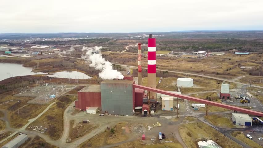 Aerial shot of coal power plant in Canada during winter, Port Hawksbury, Nova Scotia, Canada