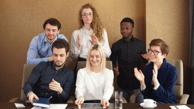 Satisfied diverse office workers clapping hands after business seminar, happiness, victory, winners, feeling, emotion, congratulation video