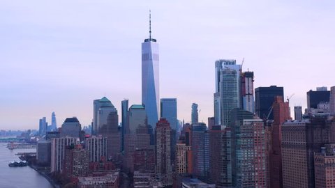 Freedom Tower on a gloomy day; downtown manhattan; aerial slow pan; cinematic.