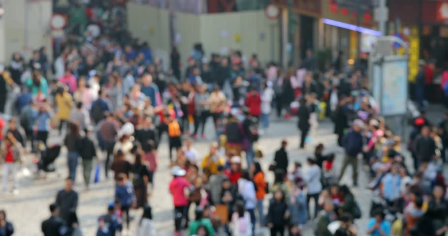 Bokeh of people walk in the street