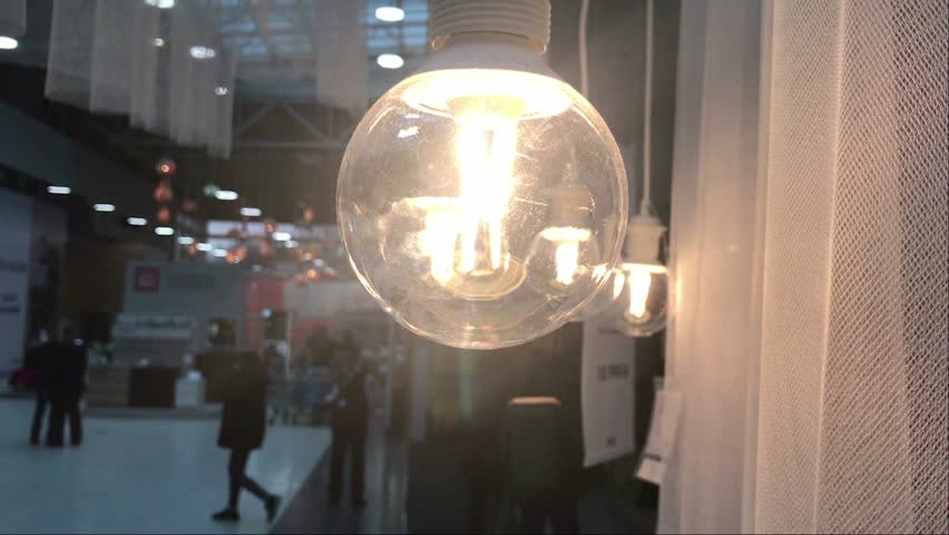 People in the mall through the lamp