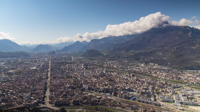 Time lapse of Grenoble city view from the Bastille. French Alps sunny day 