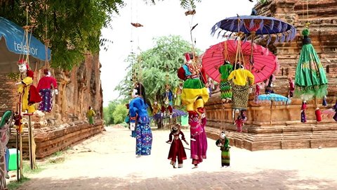 BAGAN, MYANMAR, MAY 17 2018,  Traditional Myanmar puppets hangs on rope on tree in area Buddhist temple.