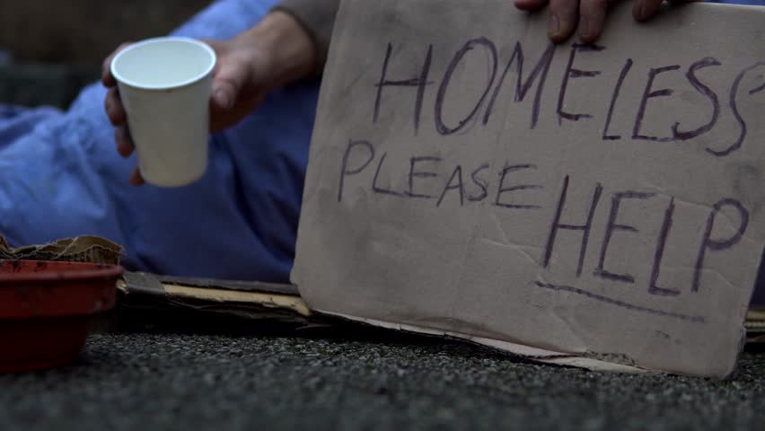 Homeless Man Sat Begging With Sign 'Please Help' On Road, 4K. Royalty-Free Stock Footage #1023100120