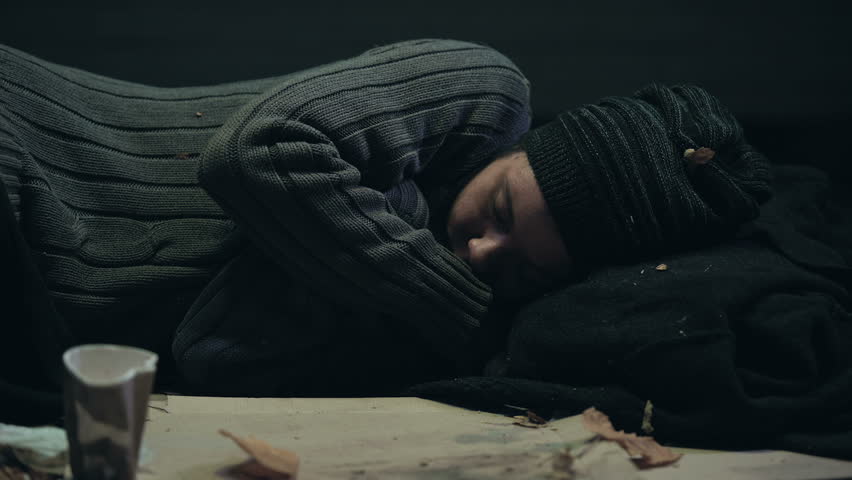 Volunteer covering homeless person shivering with cold, shelter for poor people | Shutterstock HD Video #1023101542