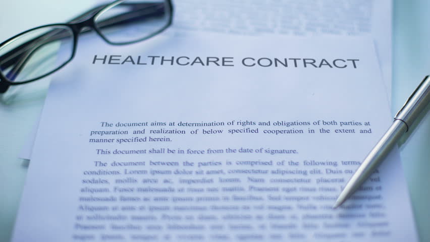 Healthcare contract approved, officials hand stamping seal on business document Royalty-Free Stock Footage #1023101902