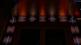Ungraded: Multicolored diodes at the entrance to the gambling club flicker and flash in the night. Ungraded H.264 from camera without re-encoding.