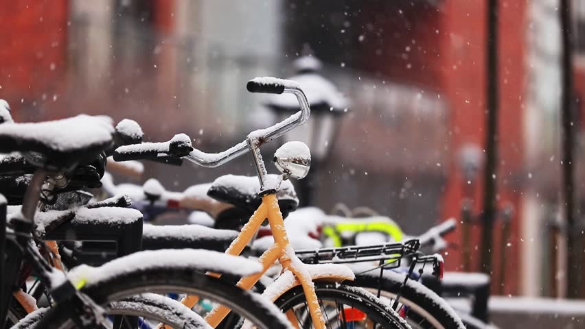 video of a vintage bike during a heavy snowfall in Europe