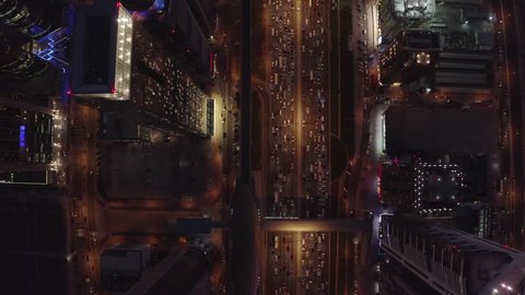 Aerial drone video of moving traffic at night. Sheikh Zayed Road. Main highway of Dubai. 
