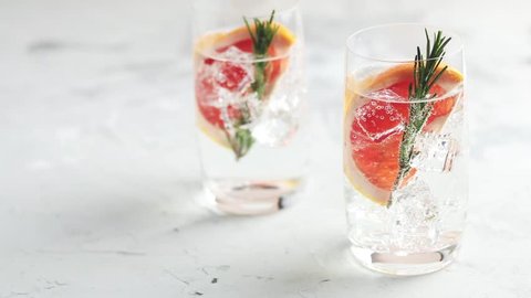Grapefruit gin and tonic selection drink alcohol cocktail or detox water, refreshing drink with ice, elective focus, shallow depth of the field.