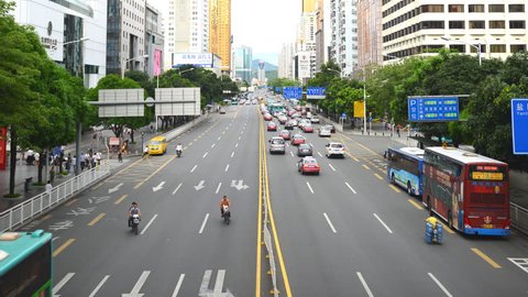 SHENZHEN, CHINA - MAY 15, 2012 Time Lapse Aerial View of Shenzhen Cars Traffic on Street Commuters Commuting
