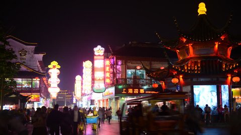 NANJING, CHINA - MAY 5, 2012 Time Lapse of Crowd of People Walking on Shopping Street Market in Nanjing Night