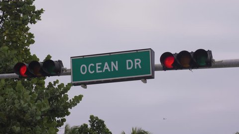 Ocean Drive Road Sign and Traffic Light in Miami Beach. USA. Medium Shot