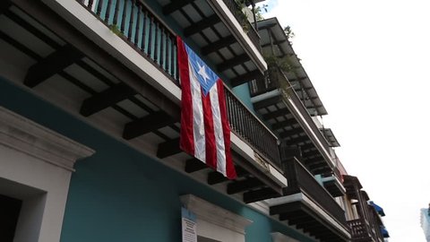 Puerto Rico flag hanging from balcony in Old San Juan